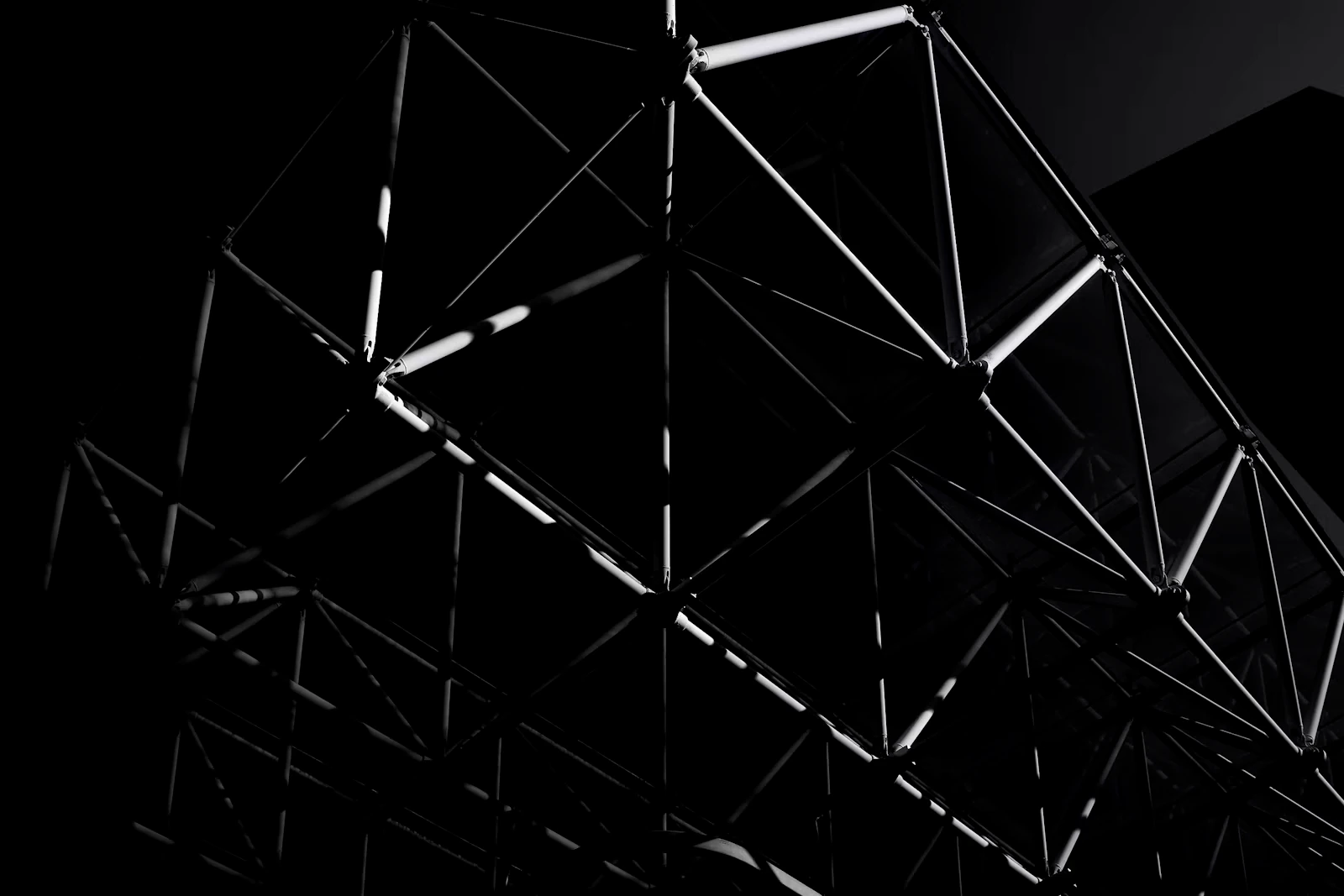 Dramatic dark, angular steel space-frame truss structure