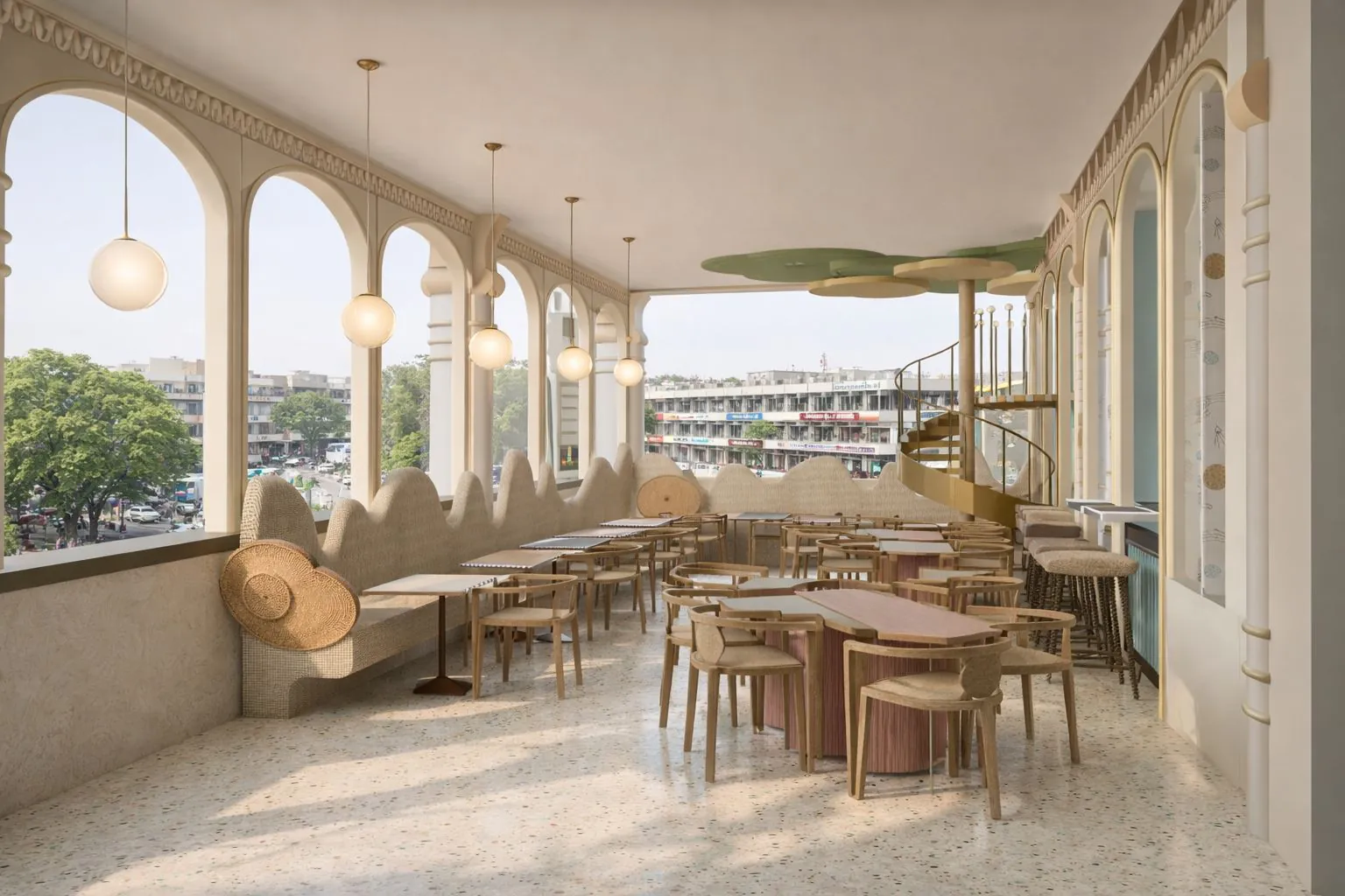 Cafe seating along a run of arched windows with pendant lighting above the tables