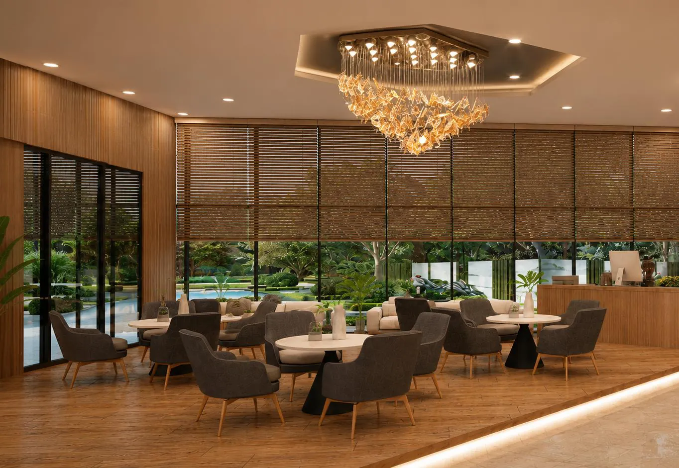 Cafe seating in a sales lounge with a statement chandelier and full-height glazing