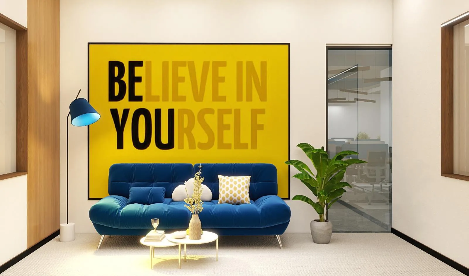 Breakout lounge with a blue sofa against a yellow motivational graphic wall