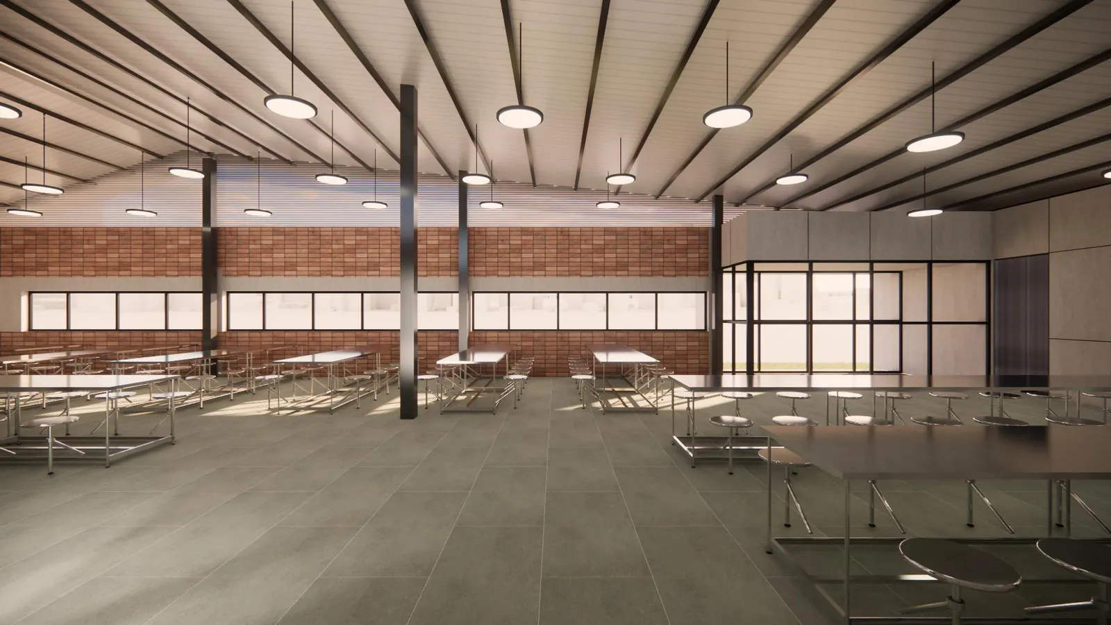 Workers' dining hall with fixed bench tables and stools under a metal roof