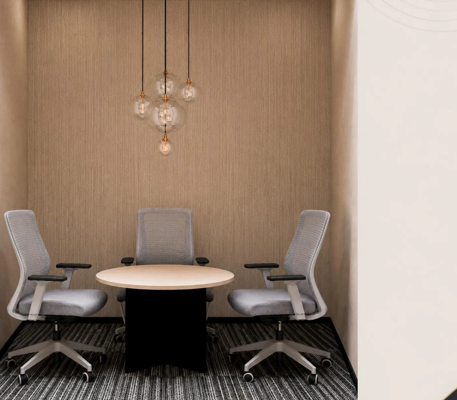 Small three-seat meeting nook with a round table and cluster pendant light