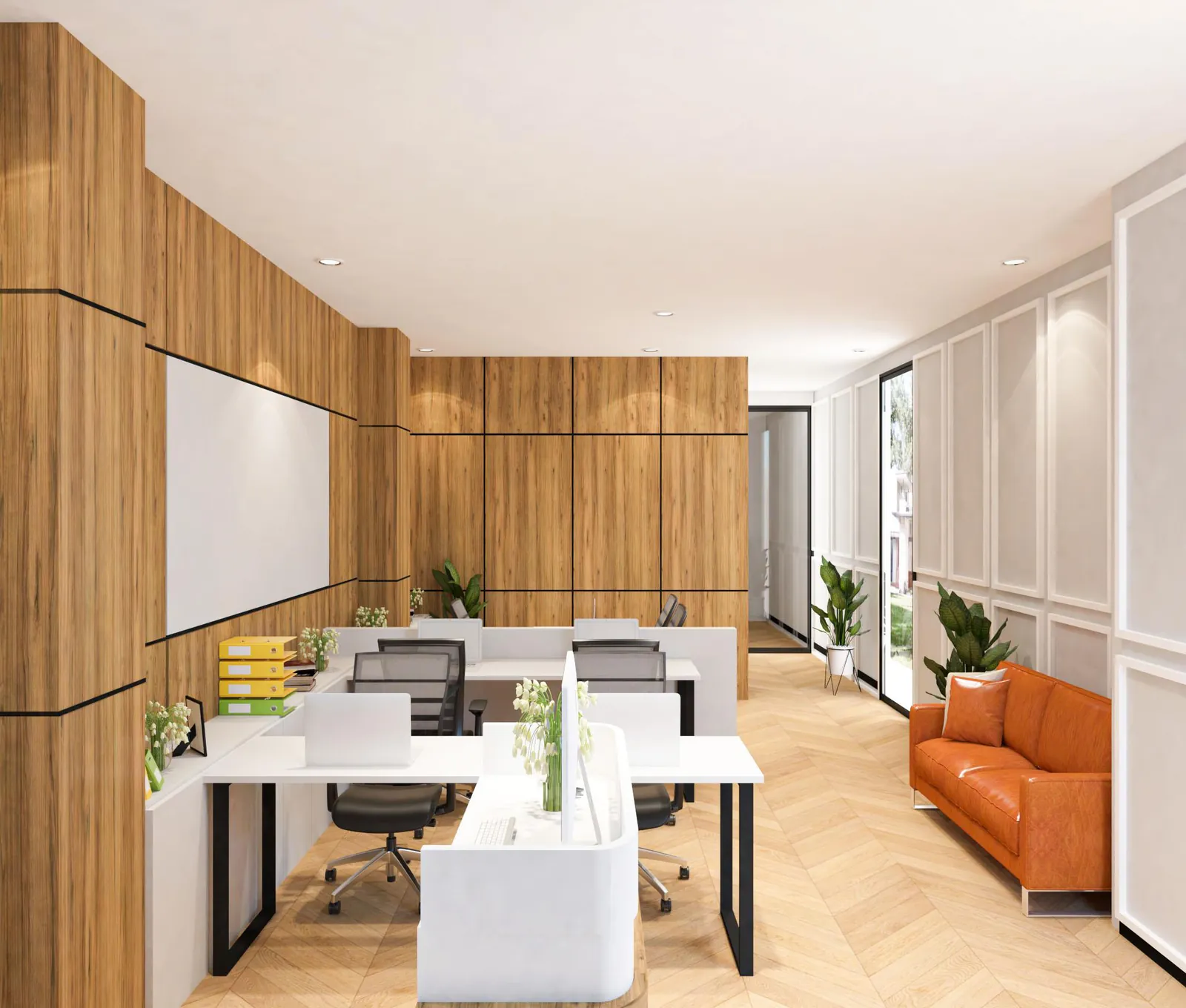 Small office workstation bay in linear desks with herringbone wood flooring and a sofa