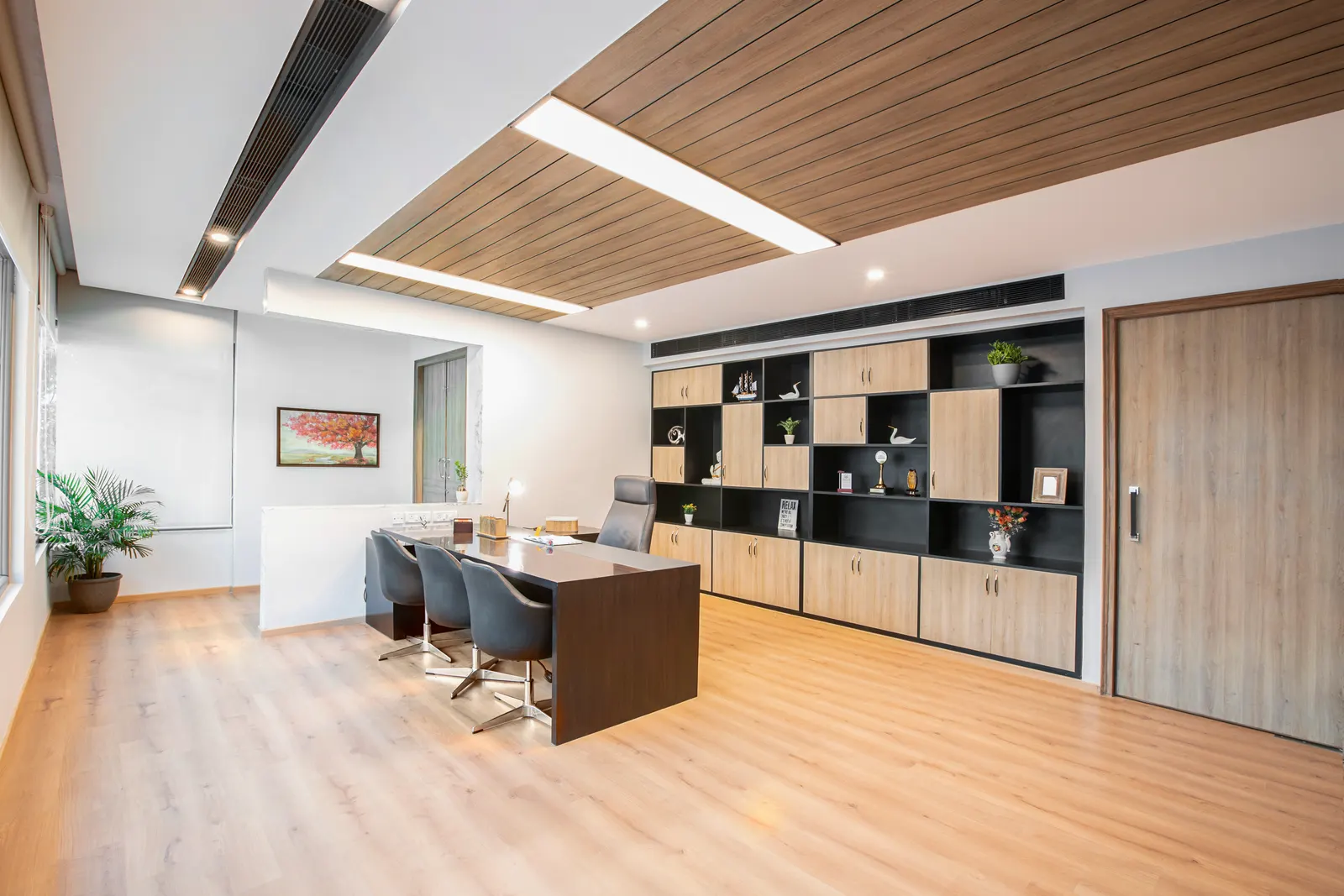 Imperial Malts director's cabin seen from the entrance, with the full-wall storage unit and meeting chairs