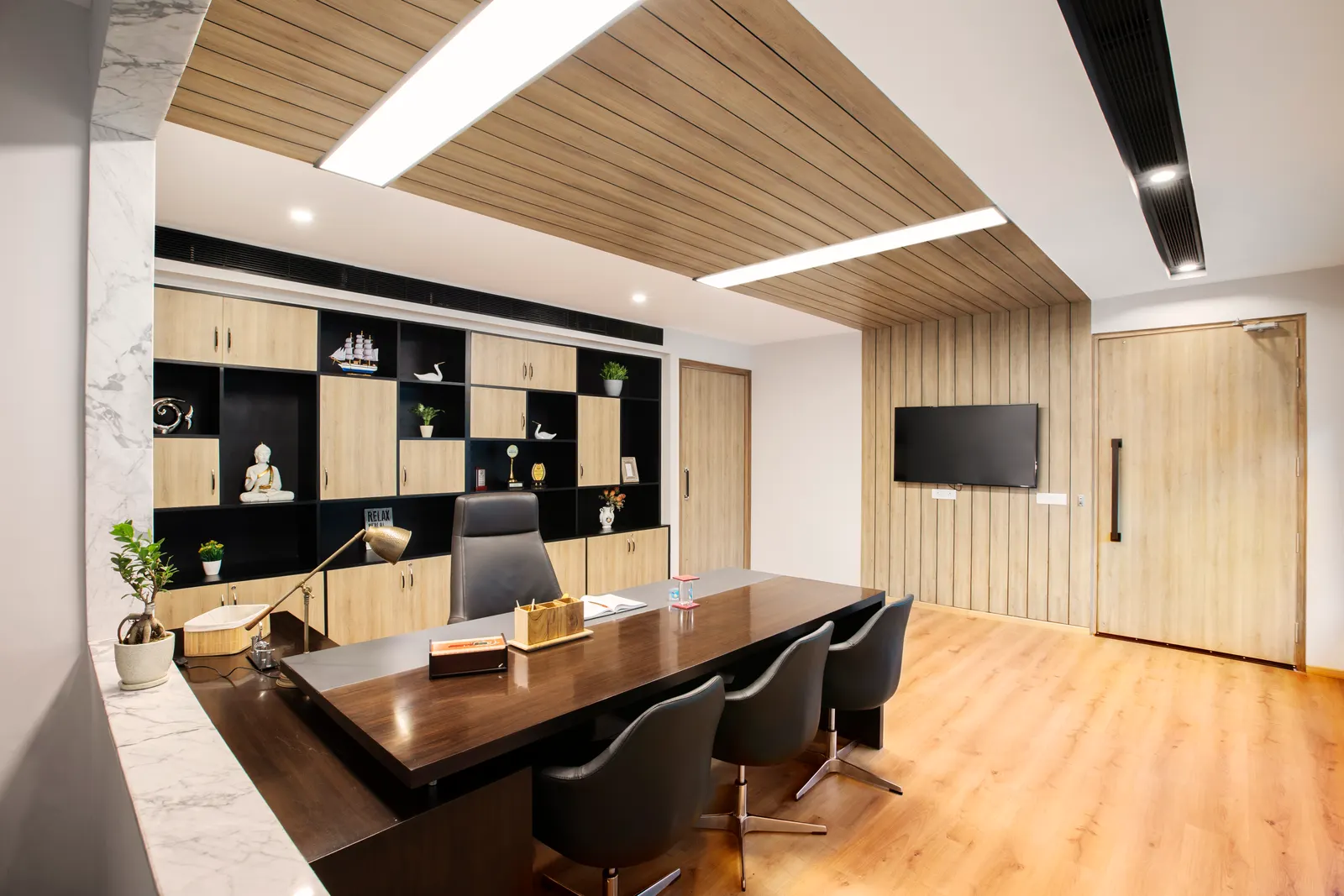 Imperial Malts director's cabin with a timber-slatted ceiling, display storage wall and a dark timber desk