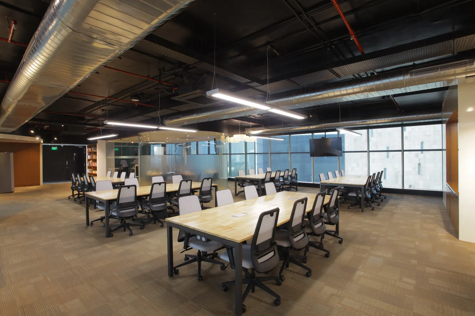 Inshorts Media open-plan office with long team desks under linear lights