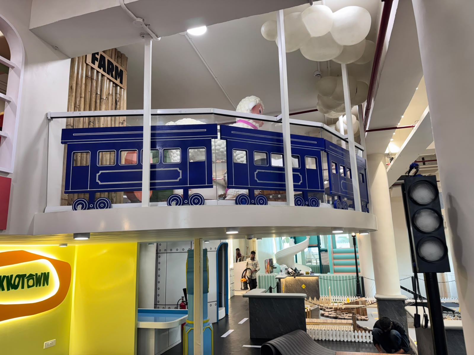 Farm-themed mezzanine train-carriage viewing balcony overlooking the Kokko Town ground floor