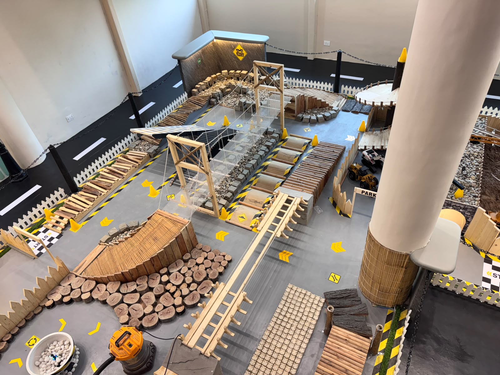 Aerial view of the Kokko Town RC vehicle off-road obstacle course with rope bridge and log obstacles