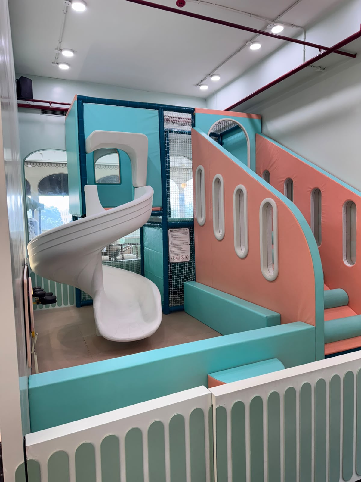 Airplane-themed toddler soft play structure with spiral slide at Kokko Town