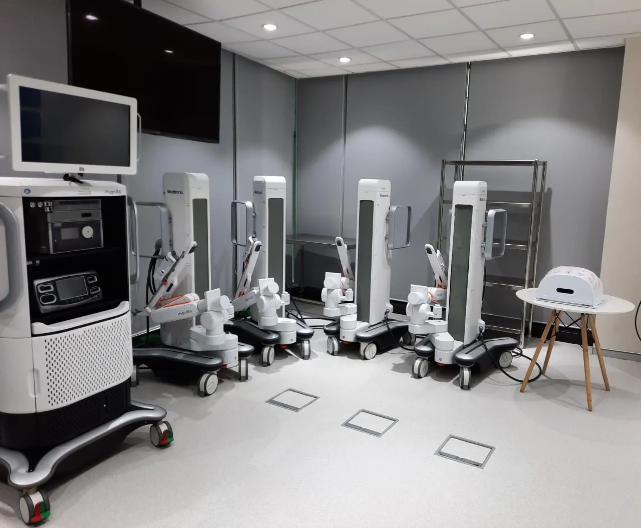 Medtronic equipment bay with medical systems arranged along a grey wall and floor service boxes