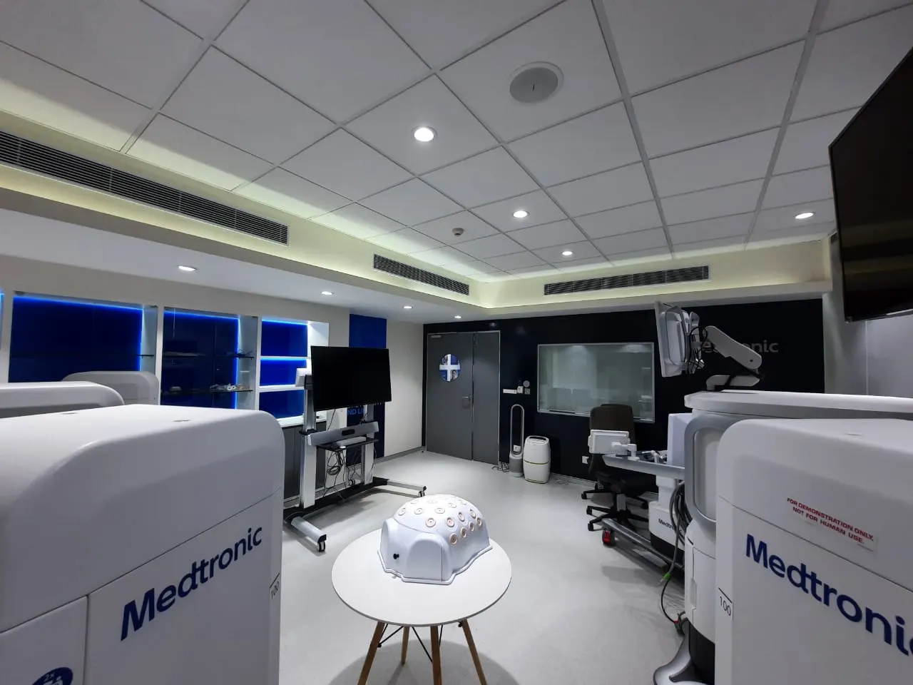 Wide view of the Medtronic training room with blue backlit wall panels