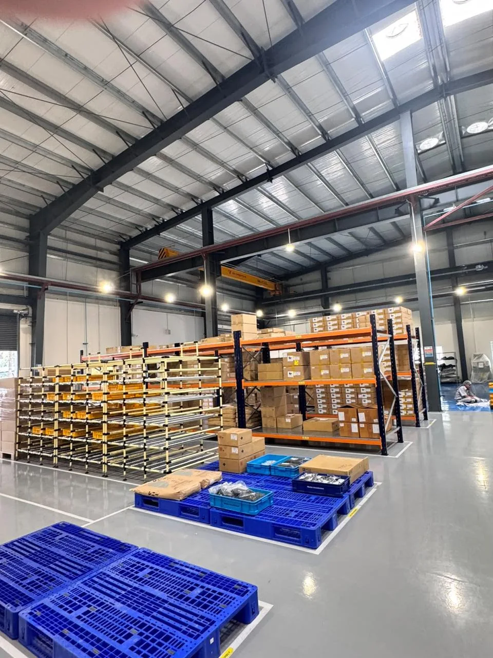 Warehouse loading bay with shutter door and pallet racking at the MinebeaMitsumi facility
