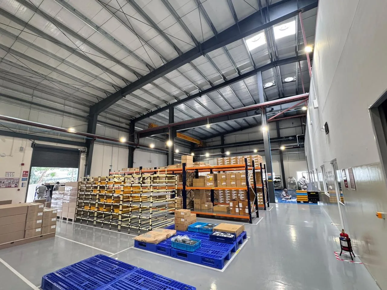 Pallet racking and boxed material storage in the MinebeaMitsumi warehouse area