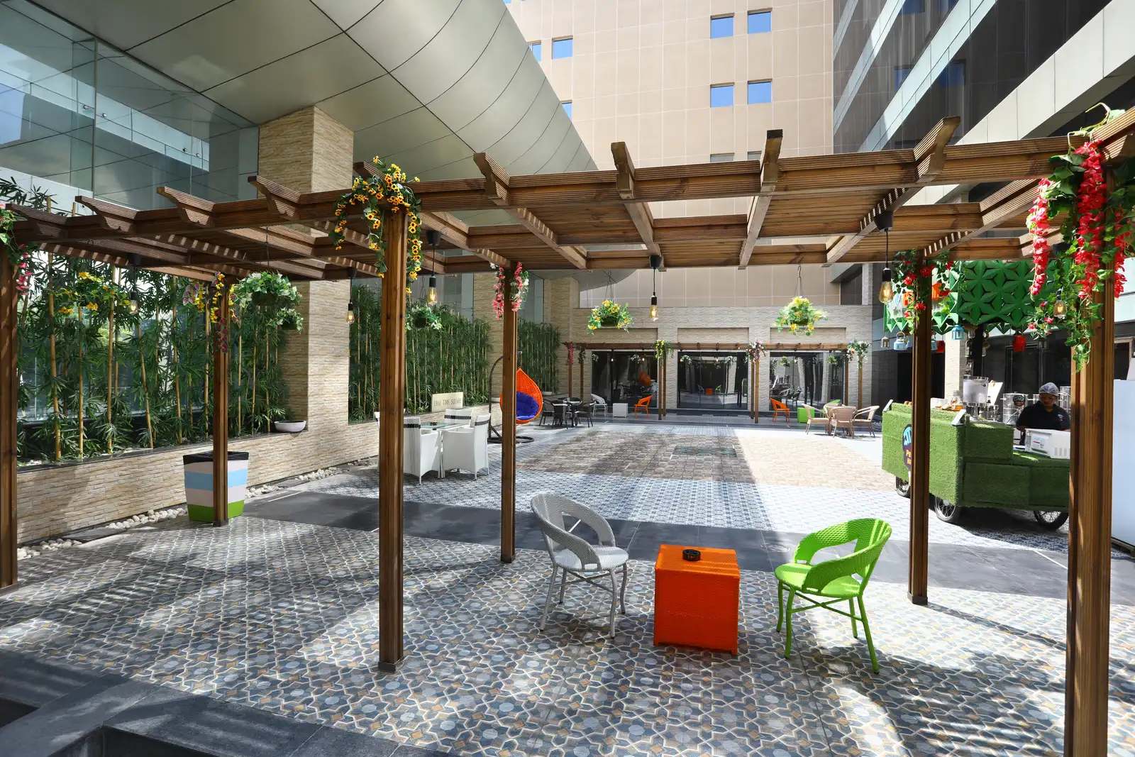SP Infocity courtyard with timber pergolas, patterned paving and outdoor seating