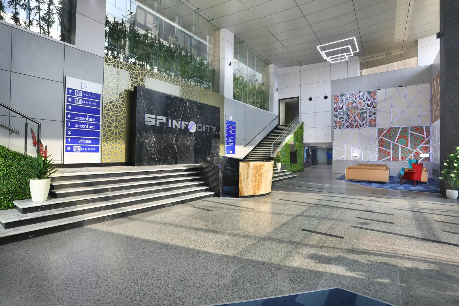 SP Infocity entrance steps with the building signage wall and vertical garden