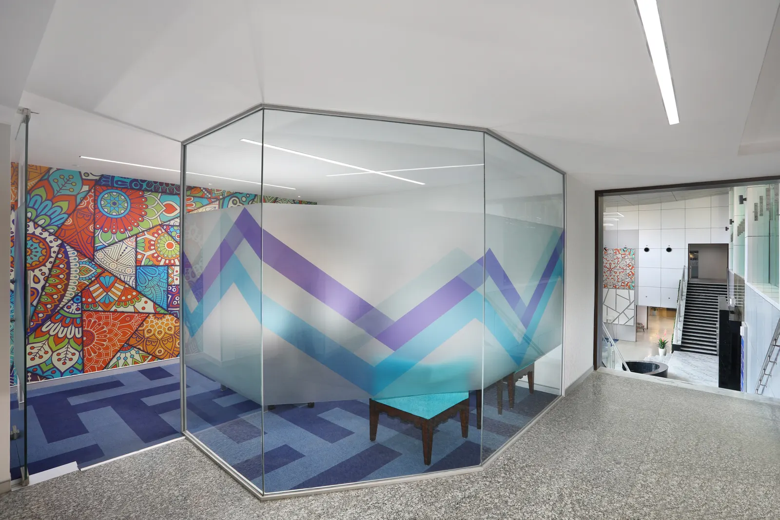 SP Infocity hexagonal glass meeting pod with a frosted chevron pattern