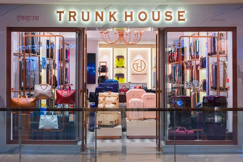 Trunkhouse glazed shopfront with illuminated signage and display shelving inside